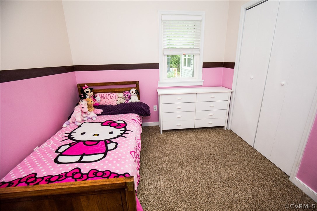 18196 Old Ridge Road Montpelier, VA 23192 - Photo 29 of 40 a bedroom with a bed and a dresser in it