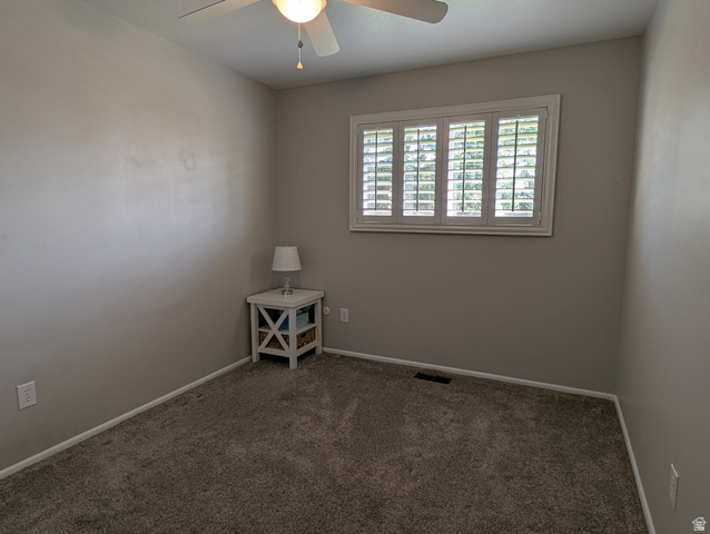 1411 Millbrook Way Bountiful, UT 84010 - Photo 24 of 36 Bedoom featuring textured carpet flooring, neutral painted walls, and a window with white plantation shutters