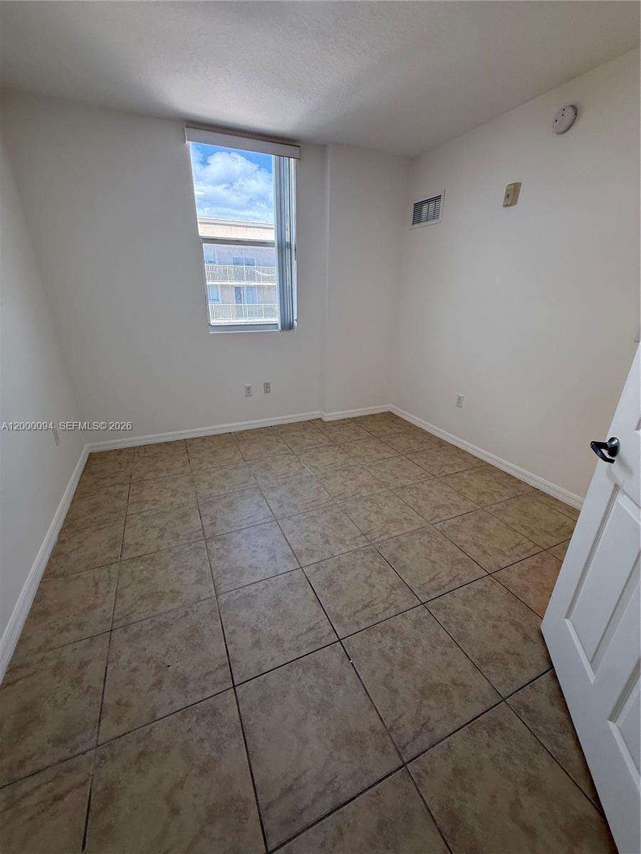 119 Southwest 6th Avenue, Unit 709 Miami, FL 33130 - Photo 11 of 18 a view of a room that has a window in it