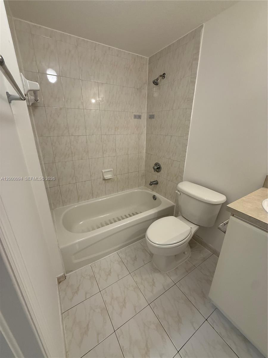 119 Southwest 6th Avenue, Unit 709 Miami, FL 33130 - Photo 9 of 18 a bathroom with a toilet and a shower