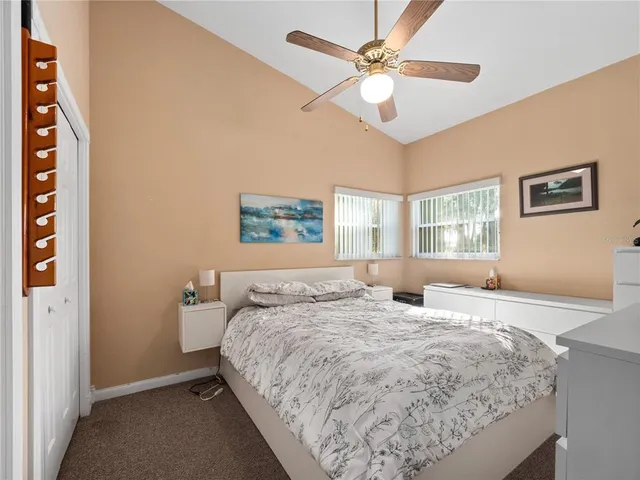 a bedroom with a large bed and a window