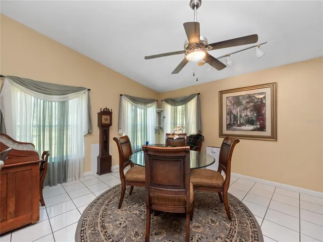 a dining room with furniture and window