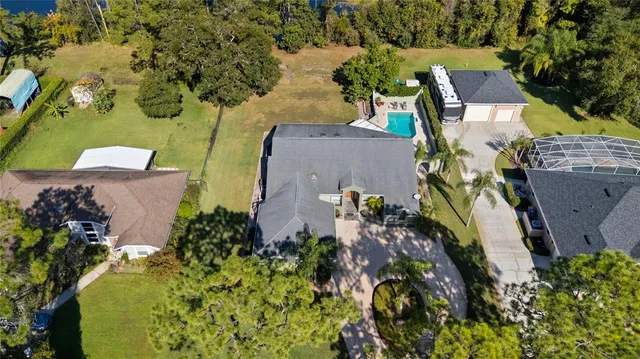 an aerial view of residential houses with outdoor space