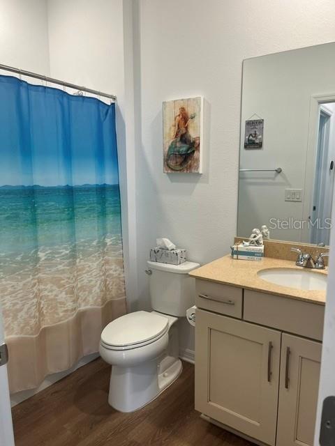 7978 Southwest 90th Terrace Ocala, FL 34481 - Photo 15 of 20 a bathroom with a toilet a sink and mirror