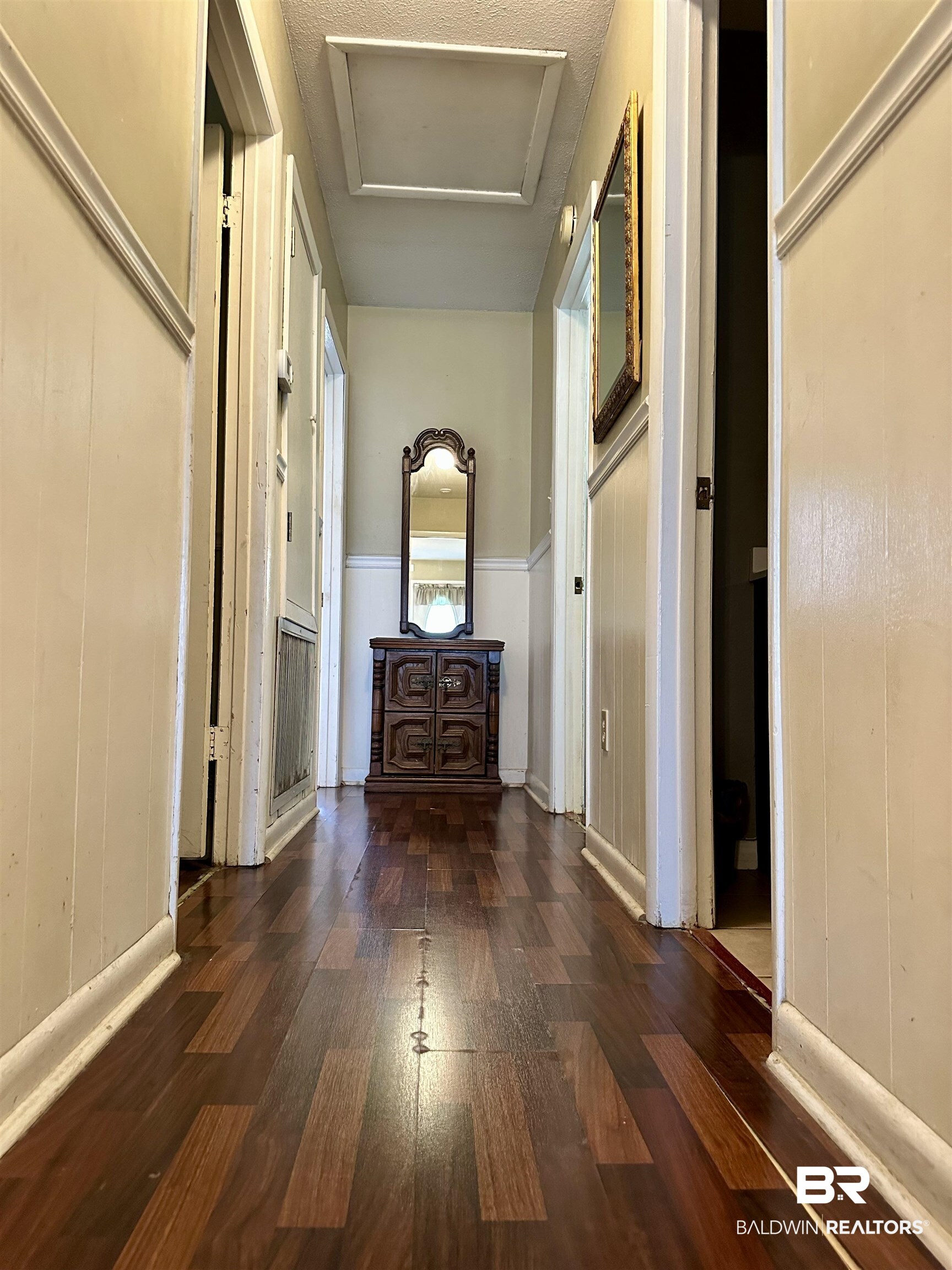 2593 Foshee Road Brewton, AL 36426 - Photo 6 of 15 Hall with a textured ceiling and dark hardwood / wood-style flooring