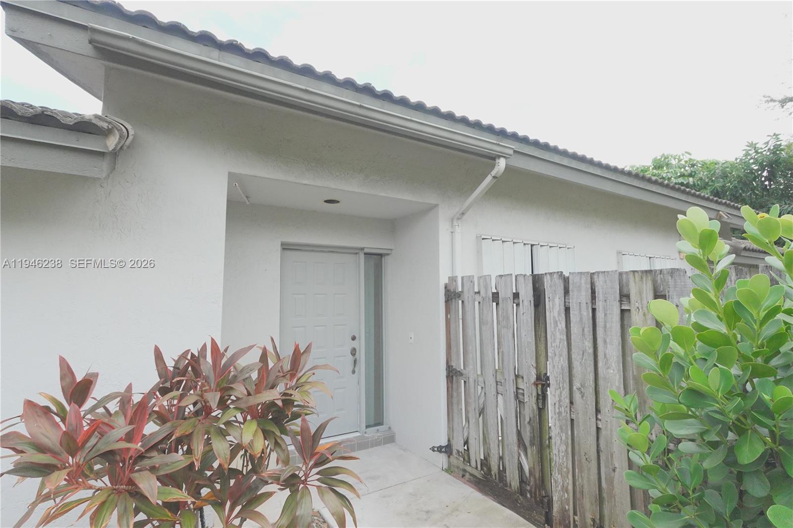 518 Northeast 48th Street, Unit 518 Boca Raton, FL 33431 - Photo 25 of 32 a house view with a seating space
