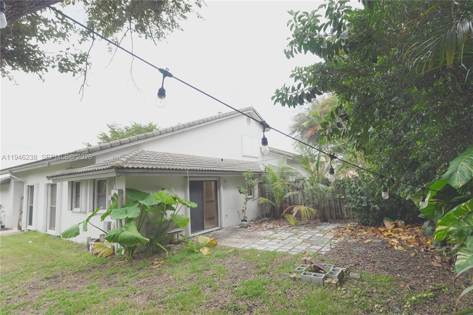 518 Northeast 48th Street, Unit 518 Boca Raton, FL 33431 - Photo 31 of 32 a view of a house with backyard