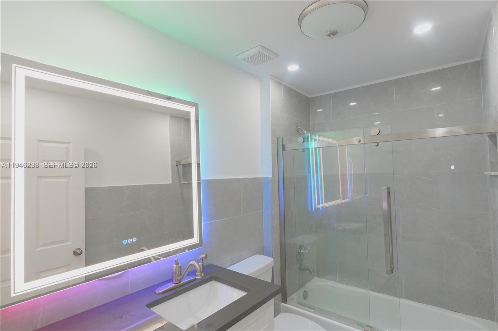 518 Northeast 48th Street, Unit 518 Boca Raton, FL 33431 - Photo 4 of 32 a bathroom with a shower