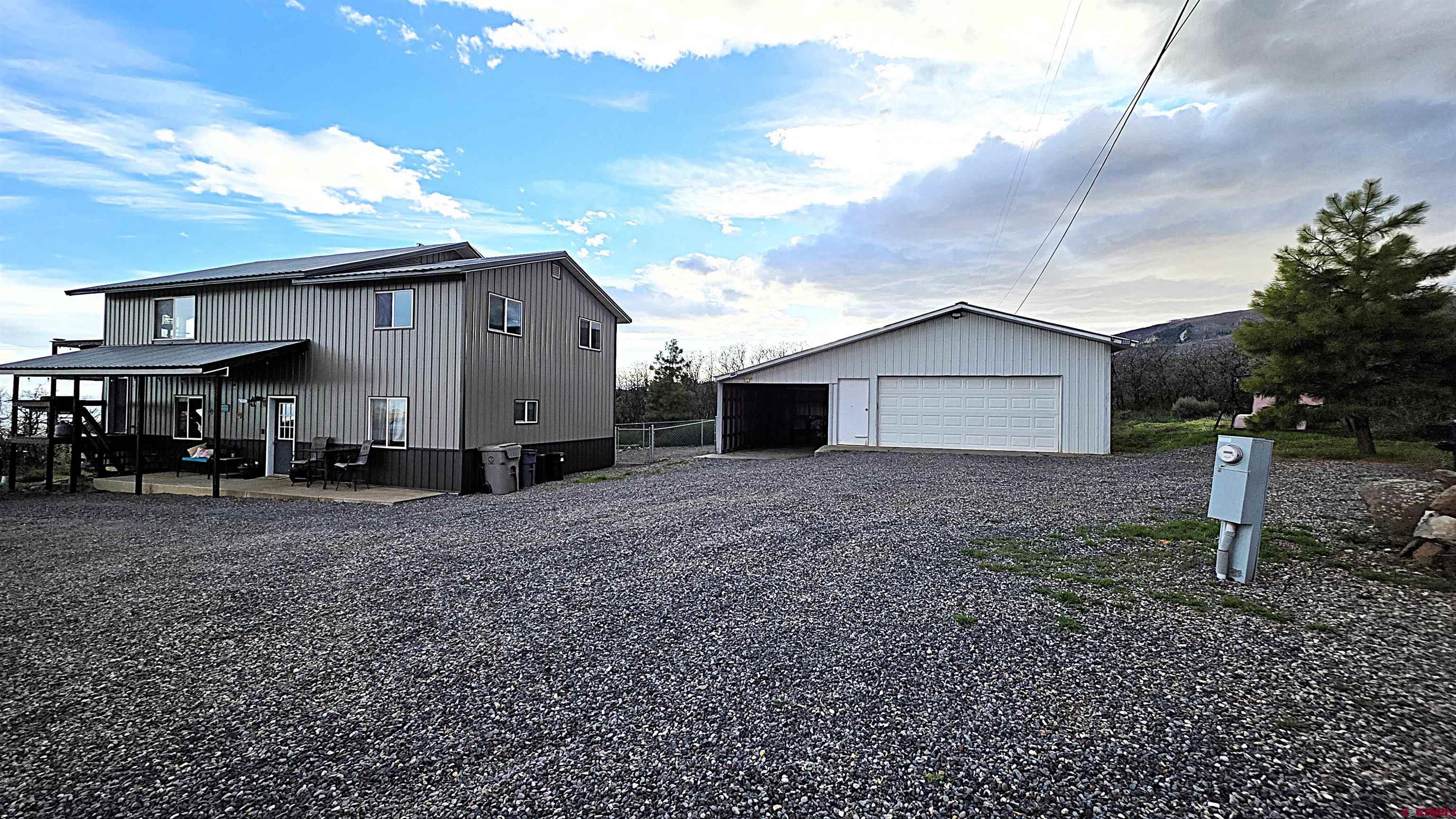 21976 2225th Road Cedaredge, CO 81413 - Photo 30 of 36 a view of a house with backyard and garden