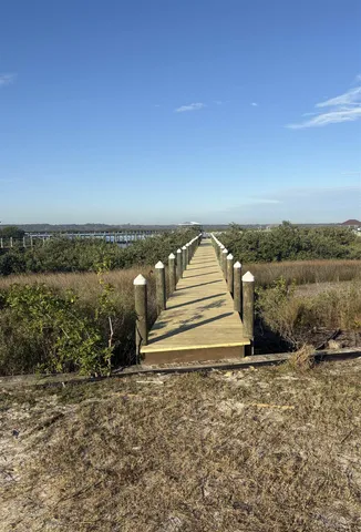 a bed sitting on top of a wooden floor