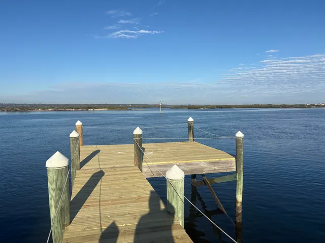 a view of swimming pool with outdoor seating and yard in back