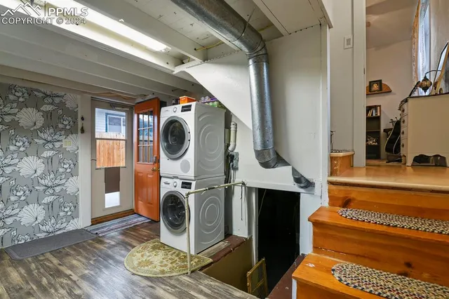 a utility room with closet dryer and washer