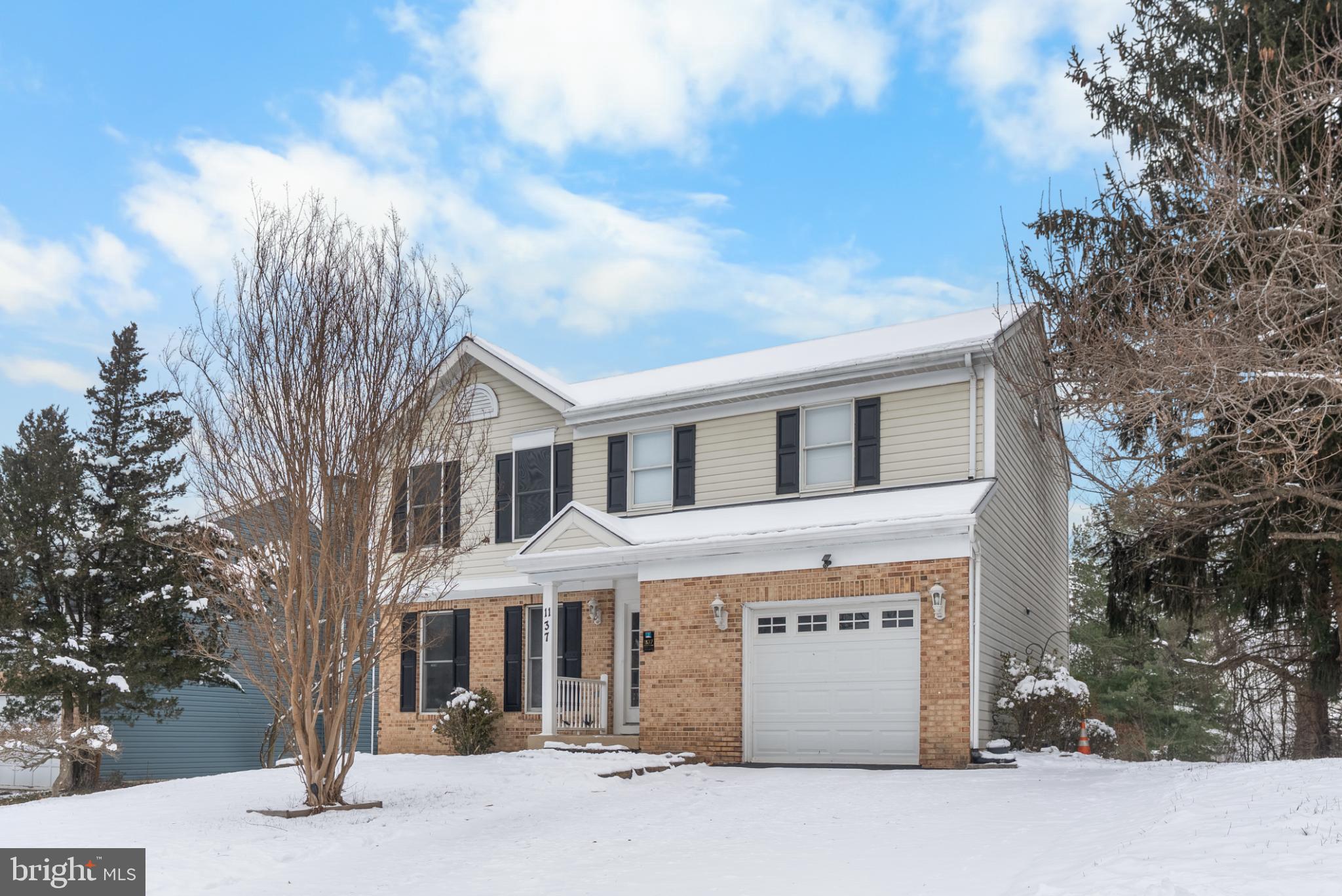 1137 Kingsbury Road Owings Mills, MD 21117 - Photo 1 of 24 a front view of a house with a yard