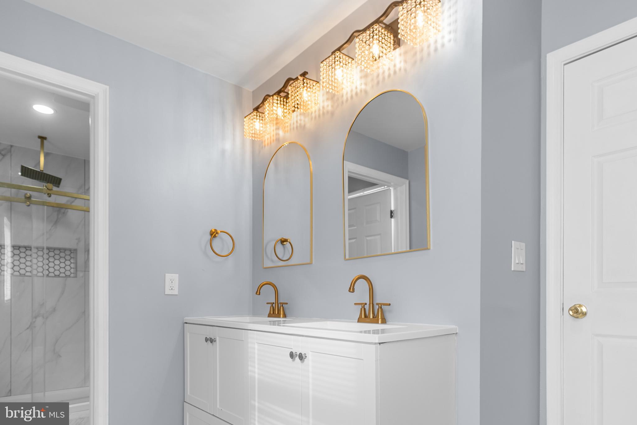1137 Kingsbury Road Owings Mills, MD 21117 - Photo 16 of 24 a bathroom with a sink and a mirror