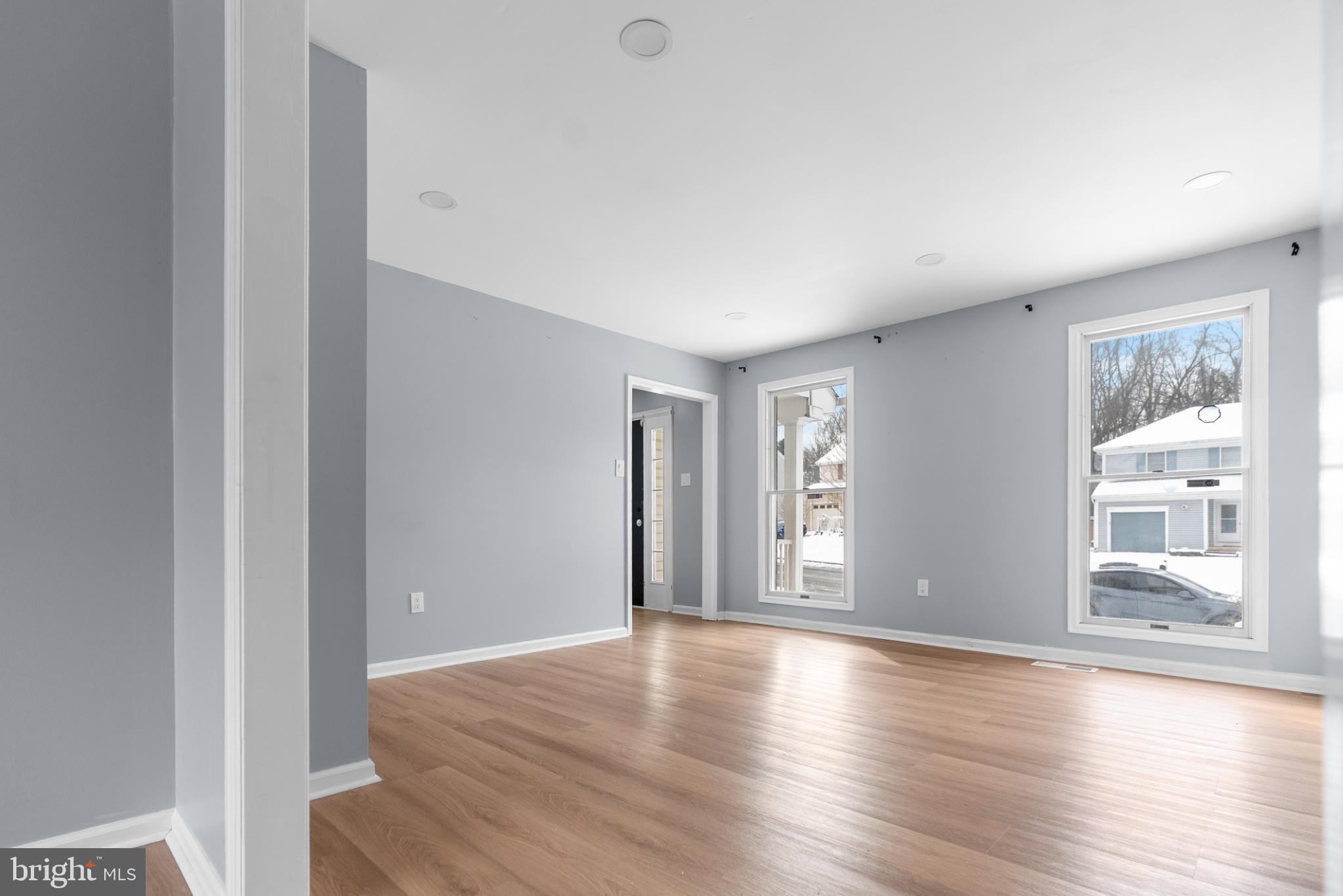 1137 Kingsbury Road Owings Mills, MD 21117 - Photo 4 of 24 a view of an empty room with wooden floor and a window
