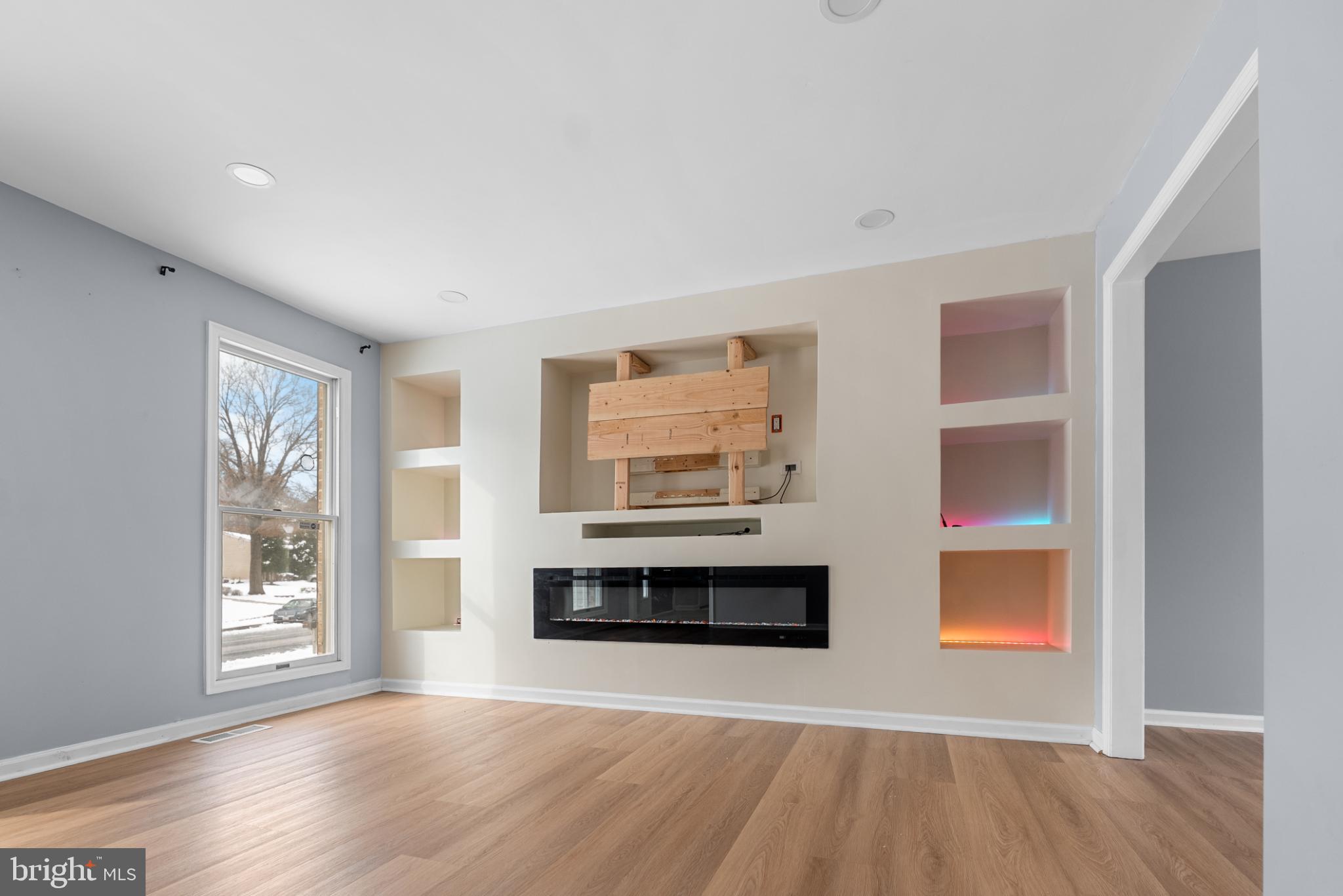 1137 Kingsbury Road Owings Mills, MD 21117 - Photo 5 of 24 a living room with a fireplace and a window