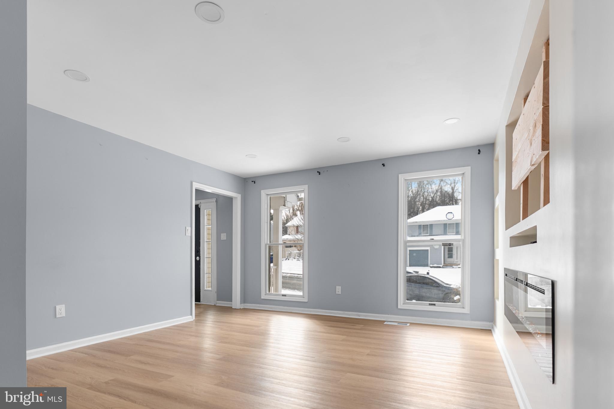 1137 Kingsbury Road Owings Mills, MD 21117 - Photo 6 of 24 a view of an empty room with wooden floor and a window