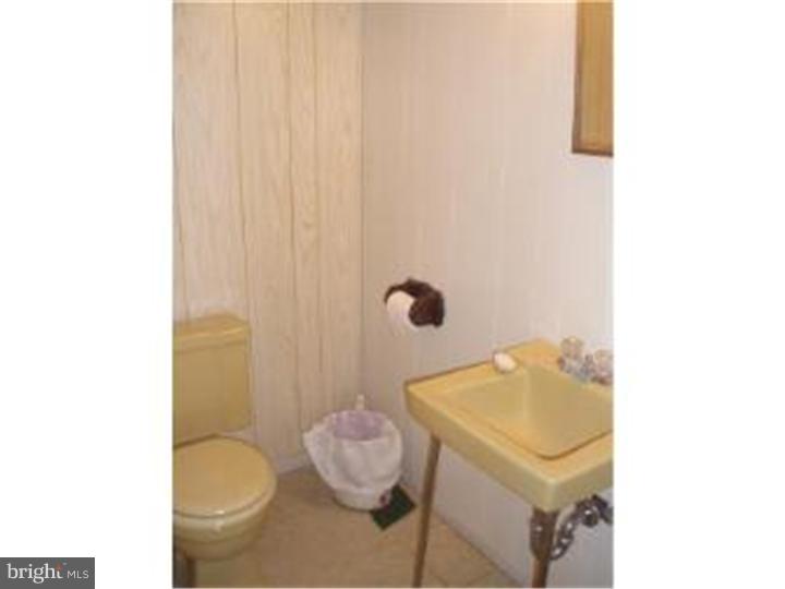 104 Valley Green Drive Aston, PA 19014 - Photo 16 of 20 a bathroom with a sink and toilet