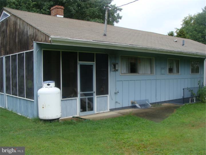 104 Valley Green Drive Aston, PA 19014 - Photo 19 of 20 a view of a white house with a big yard and large tree