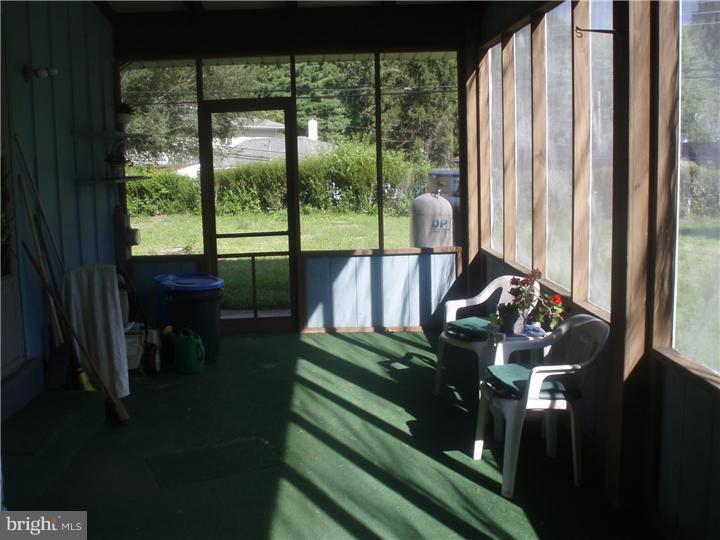 104 Valley Green Drive Aston, PA 19014 - Photo 20 of 20 a living room with large windows
