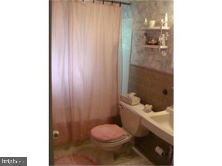 104 Valley Green Drive Aston, PA 19014 - Photo 10 of 20 a bathroom with a sink toilet and shower