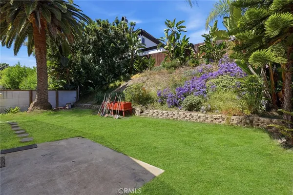 a garden with flowers and trees