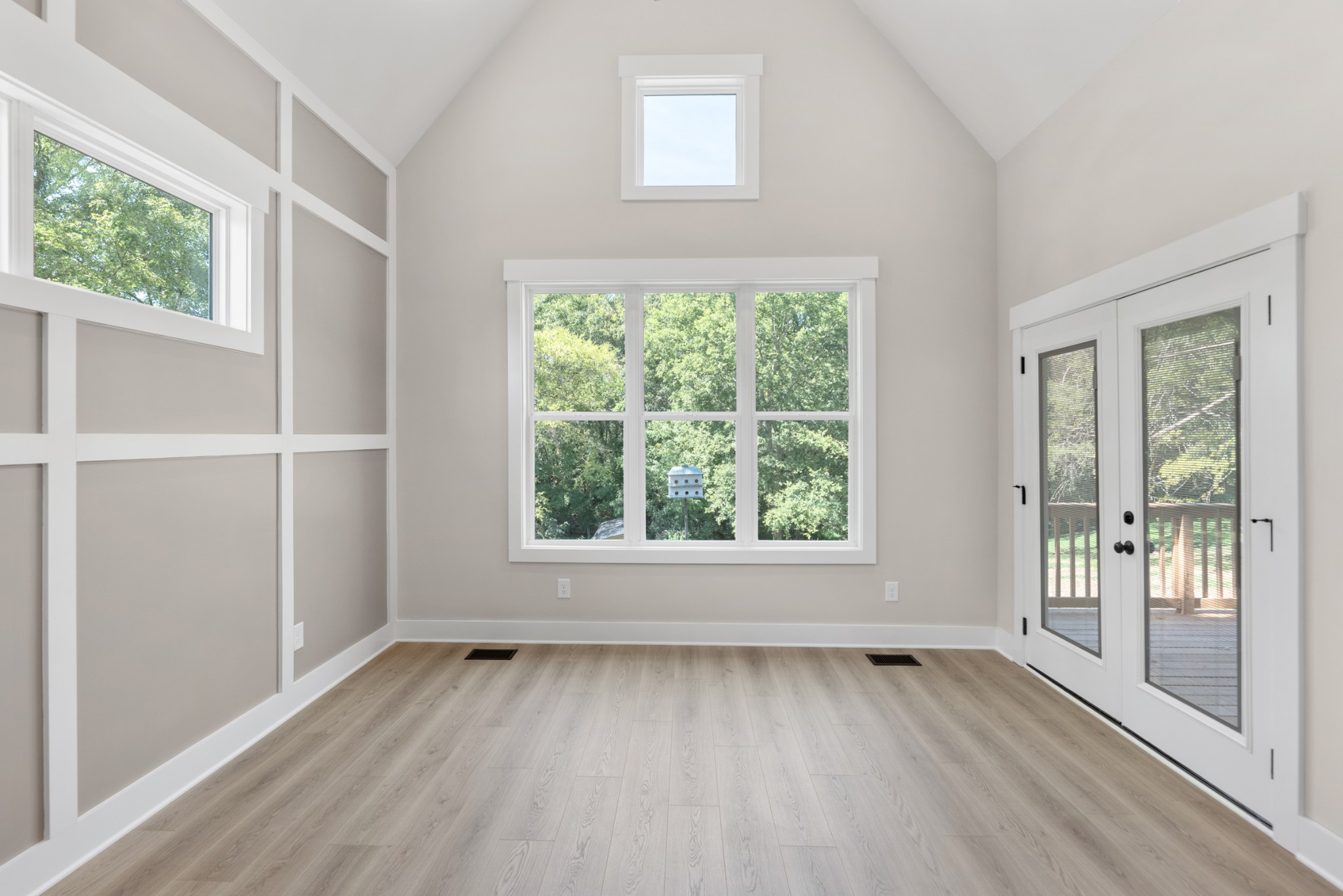 2033 Graceland Drive Goodlettsville, TN 37072 - Photo 18 of 40 an empty room with wooden floor and windows