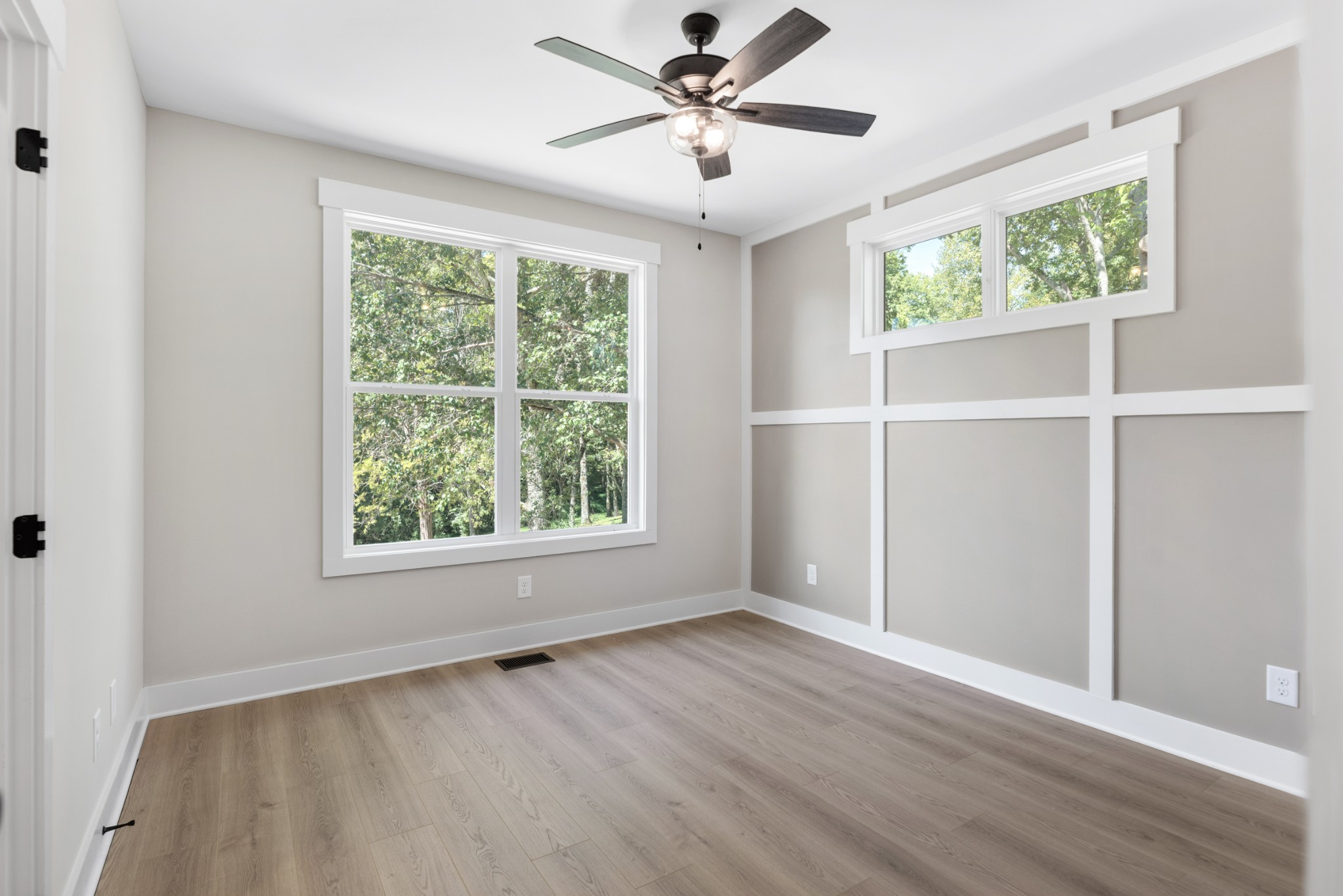 2033 Graceland Drive Goodlettsville, TN 37072 - Photo 23 of 40 a view of an empty room with a window and wooden floor