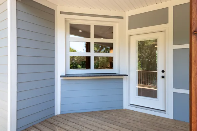 an aerial view of a house with a lake view