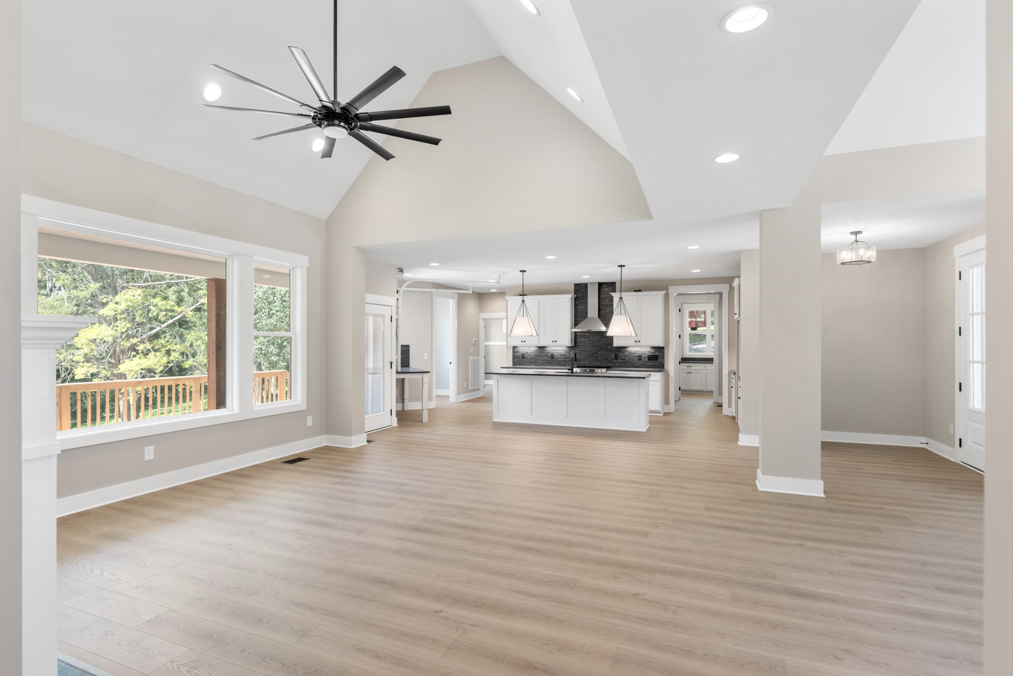 2033 Graceland Drive Goodlettsville, TN 37072 - Photo 8 of 40 a view of an empty room with a window and wooden floor