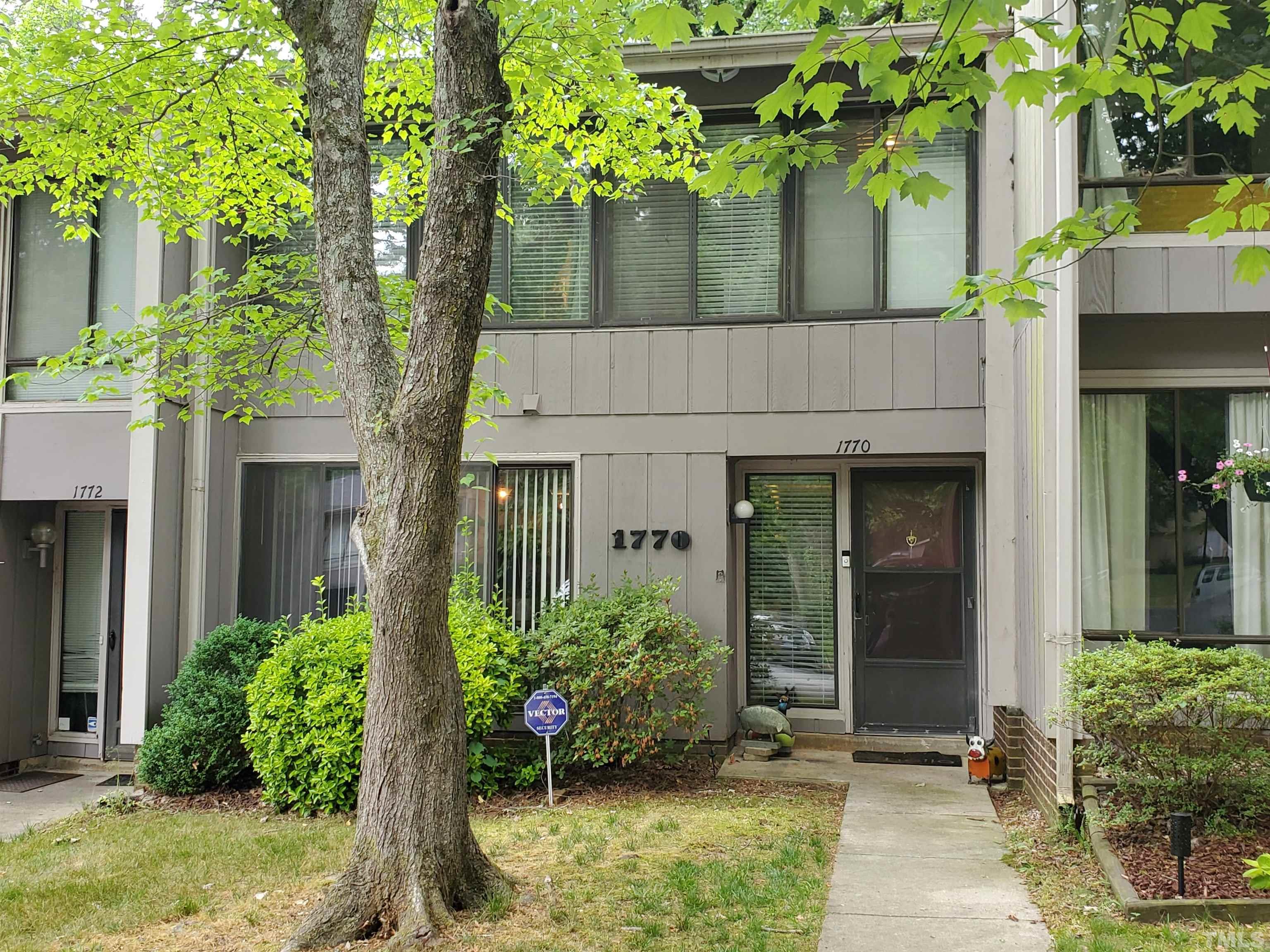 1770 Quail Ridge Road Raleigh, NC 27609 - Photo 1 of 26 a front view of a house with garden