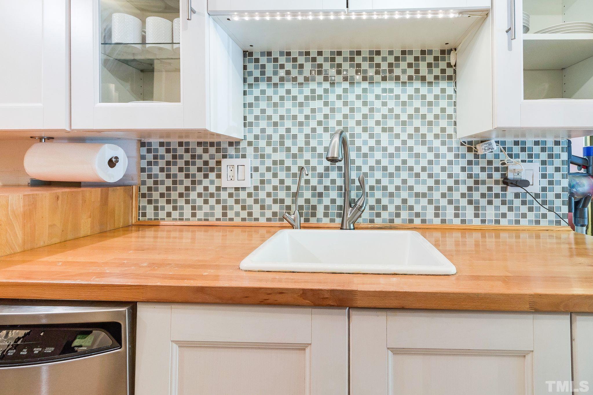 1770 Quail Ridge Road Raleigh, NC 27609 - Photo 12 of 26 a view of a sink and a cabinet