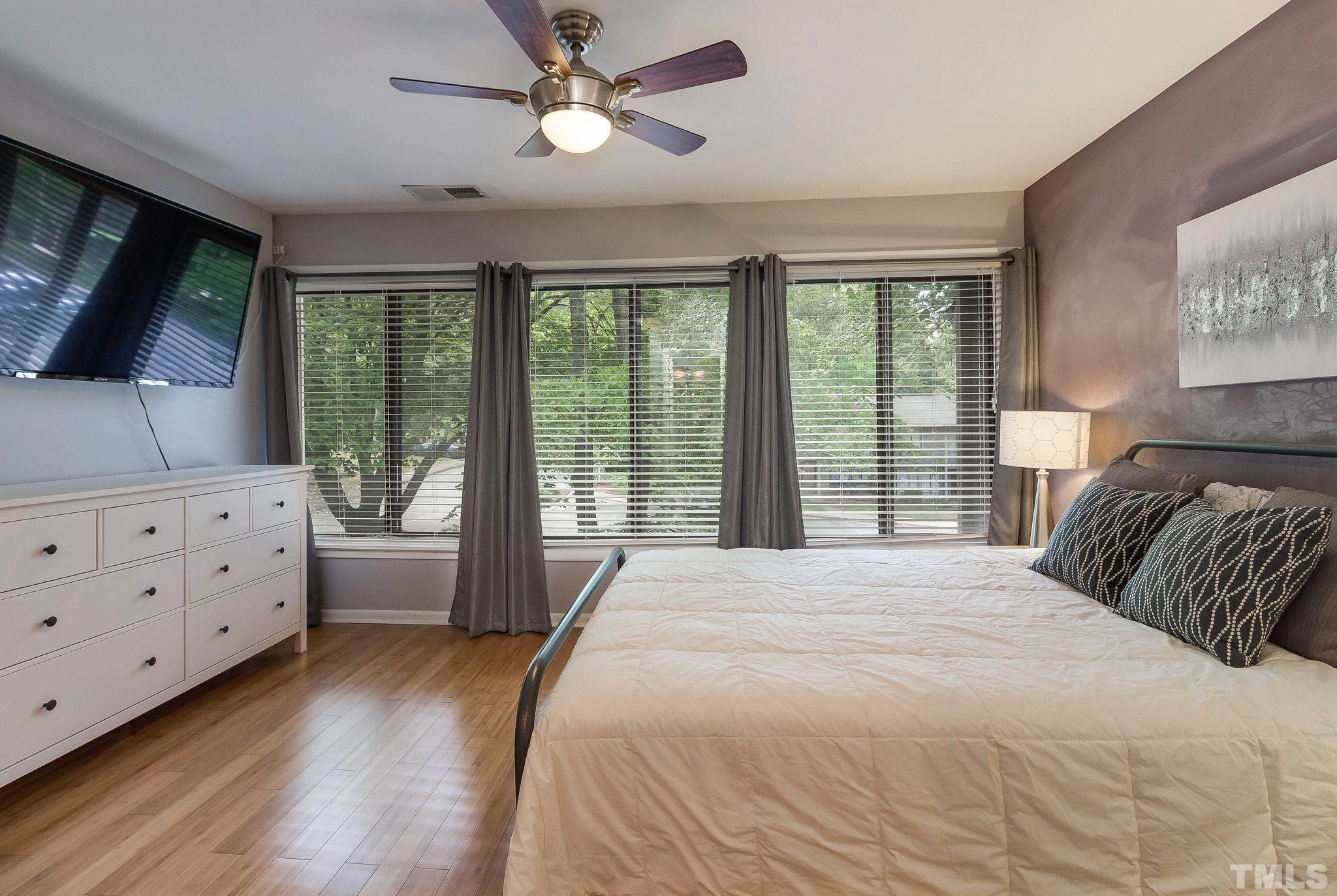 1770 Quail Ridge Road Raleigh, NC 27609 - Photo 17 of 26 a bedroom with a bed dresser and a window