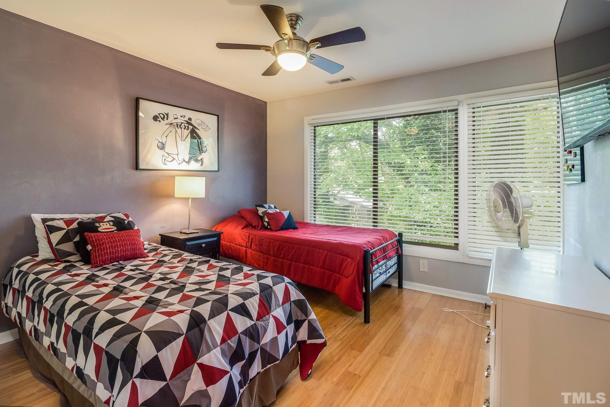 1770 Quail Ridge Road Raleigh, NC 27609 - Photo 21 of 26 a bedroom with two beds and a large window