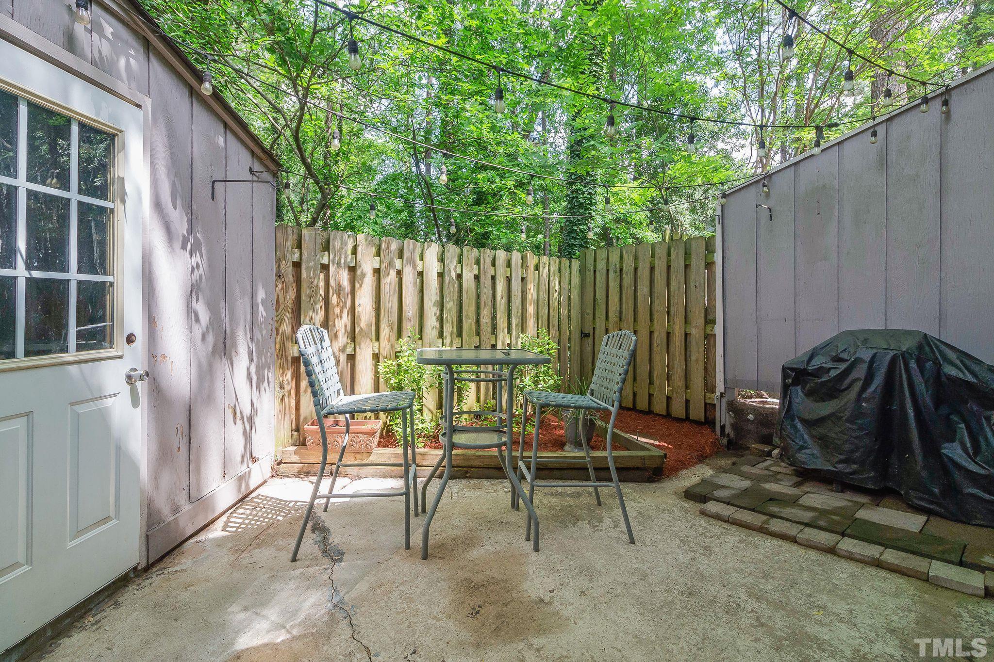 1770 Quail Ridge Road Raleigh, NC 27609 - Photo 26 of 26 a view of a chairs and table in backyard
