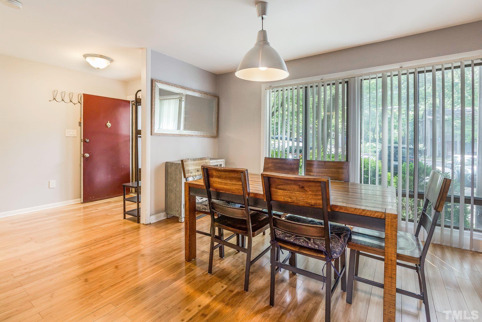 1770 Quail Ridge Road Raleigh, NC 27609 - Photo 6 of 26 a view of a dining room with furniture window and wooden floor