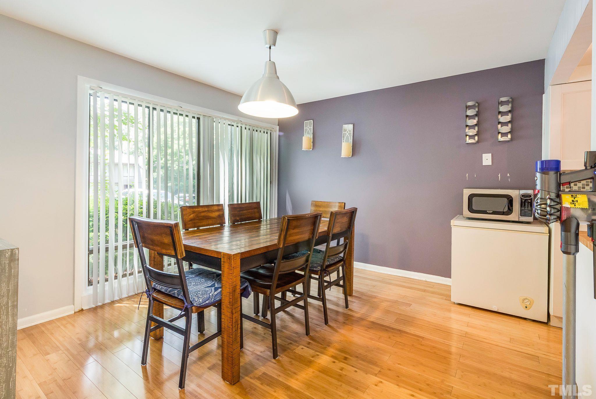 1770 Quail Ridge Road Raleigh, NC 27609 - Photo 8 of 26 a view of a dining room with furniture window and outside view