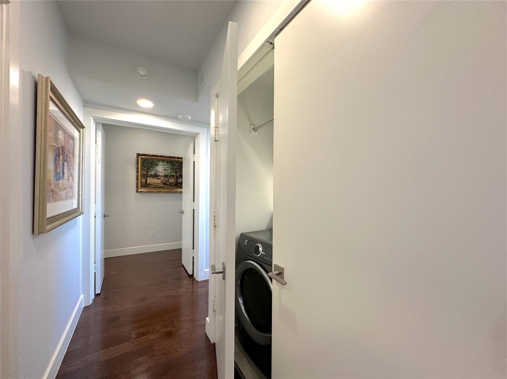 5200 Keller Springs Road, Unit 637 Dallas, TX 75248 - Photo 11 of 37 a view of a hallway with washer and dryer
