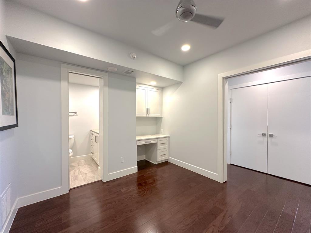 5200 Keller Springs Road, Unit 637 Dallas, TX 75248 - Photo 13 of 37 a view of a big room with wooden floor and windows