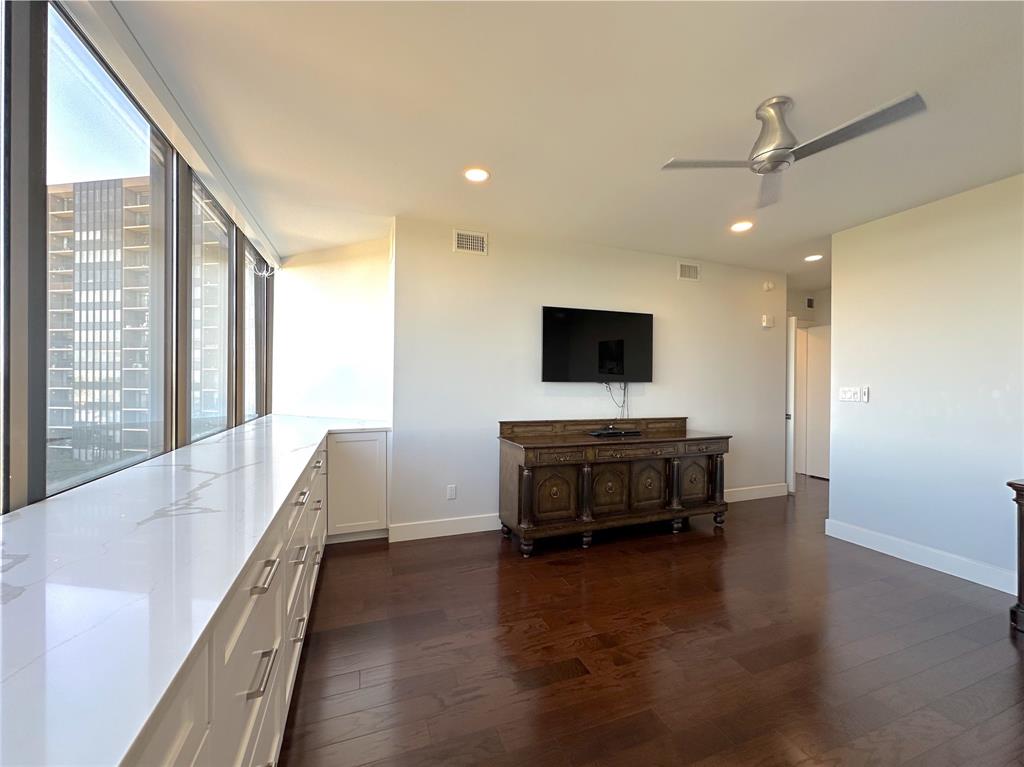 5200 Keller Springs Road, Unit 637 Dallas, TX 75248 - Photo 17 of 37 a living room with furniture and a flat screen tv