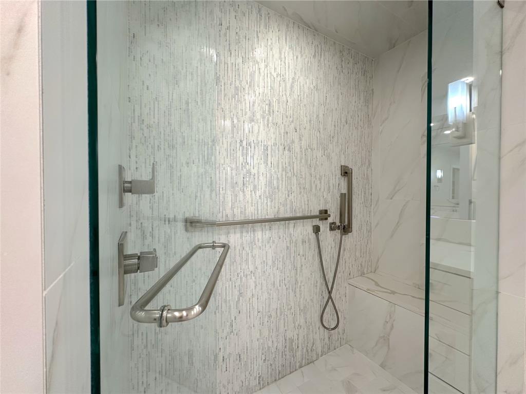 5200 Keller Springs Road, Unit 637 Dallas, TX 75248 - Photo 23 of 37 a bathroom with a glass shower door