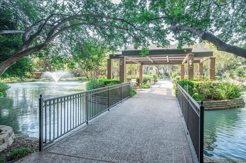 5200 Keller Springs Road, Unit 637 Dallas, TX 75248 - Photo 31 of 37 a view of a house with a small yard and large trees