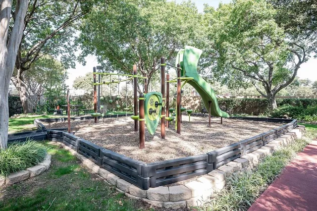 a view of a park with large trees