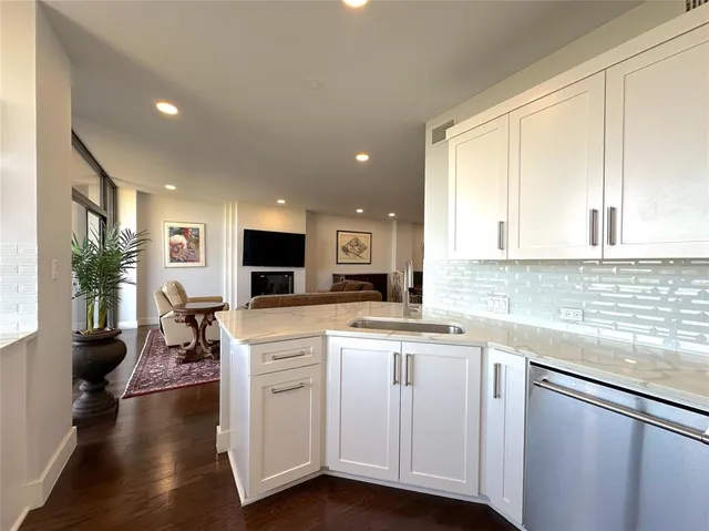 a kitchen with a sink and cabinets