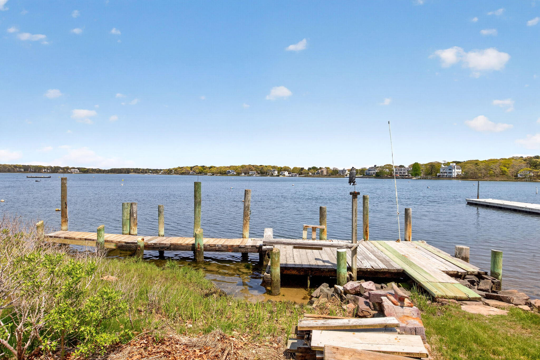 11 Clamshell Lane Mashpee, MA 02649 - Photo 33 of 43 a view of a lake with couches and city view