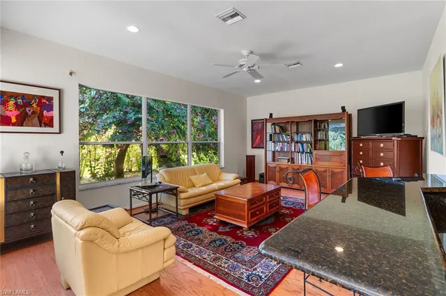 a living room with furniture fireplace and flat screen tv