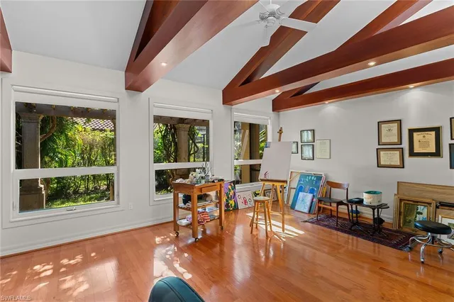 a view of a livingroom with furniture and windows