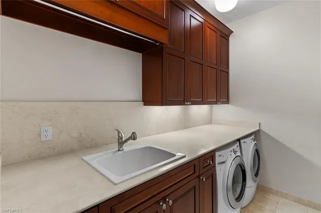 a bedroom with a bed wooden floor and large window