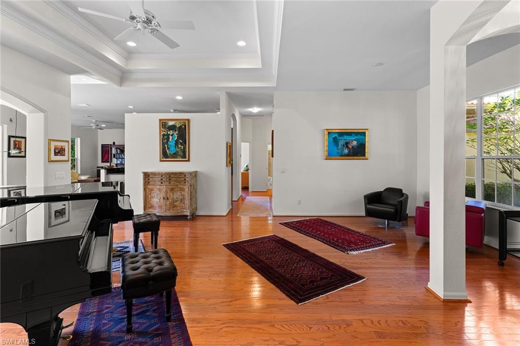 8840 Mariposa Court Naples, FL 34113 - Photo 36 of 50 a living room with furniture and a table