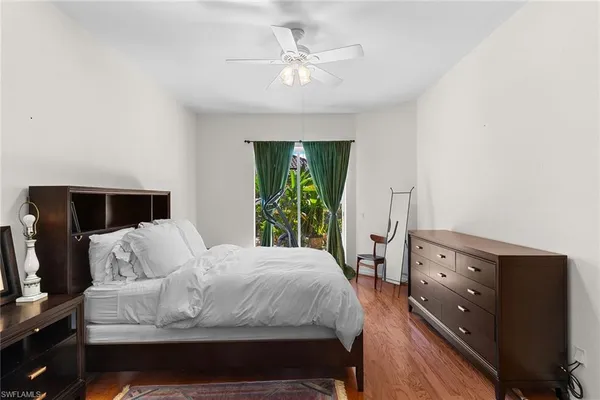 a bathroom with a tub a sink and mirror